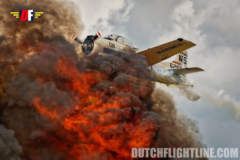 1st place AJBS photo contest 2025 | airshow photography Unique airshow photo of T-28 Trojan at La Ferté Alais 2025 flying through explosion. Picture made by Dutch Flightline Airshow Photography